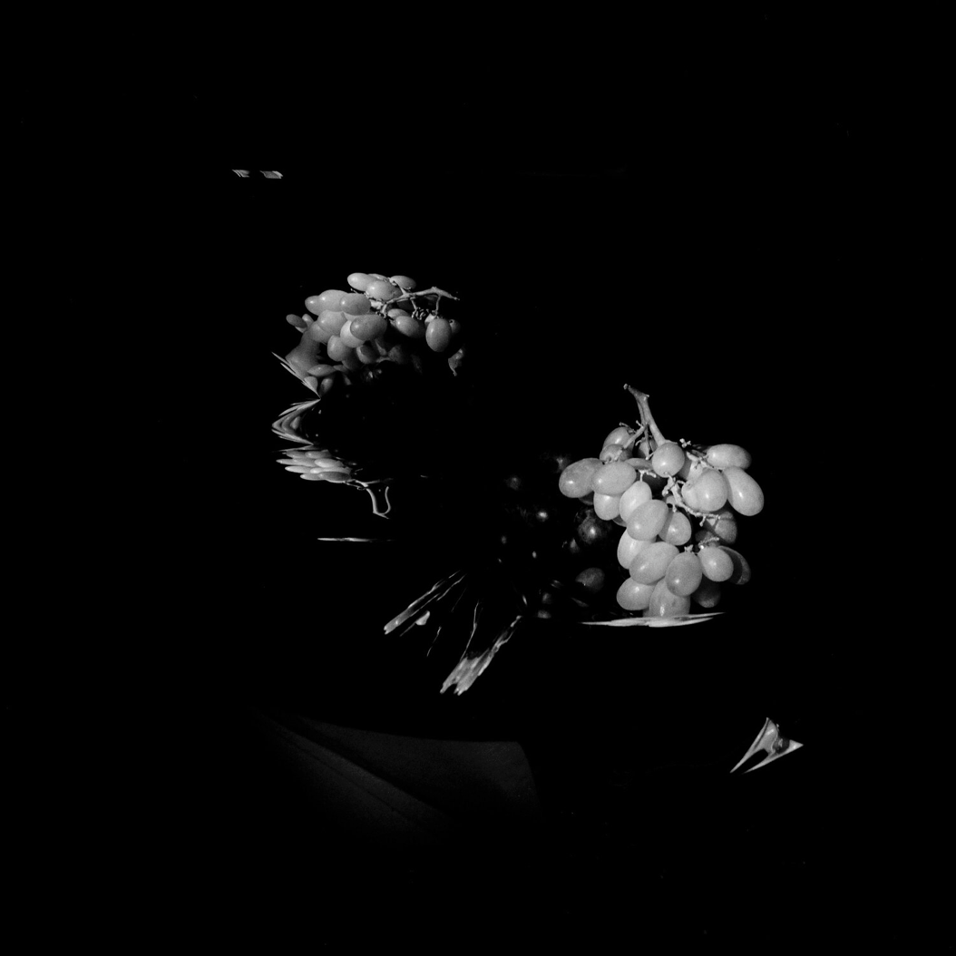 distorted grapes still life