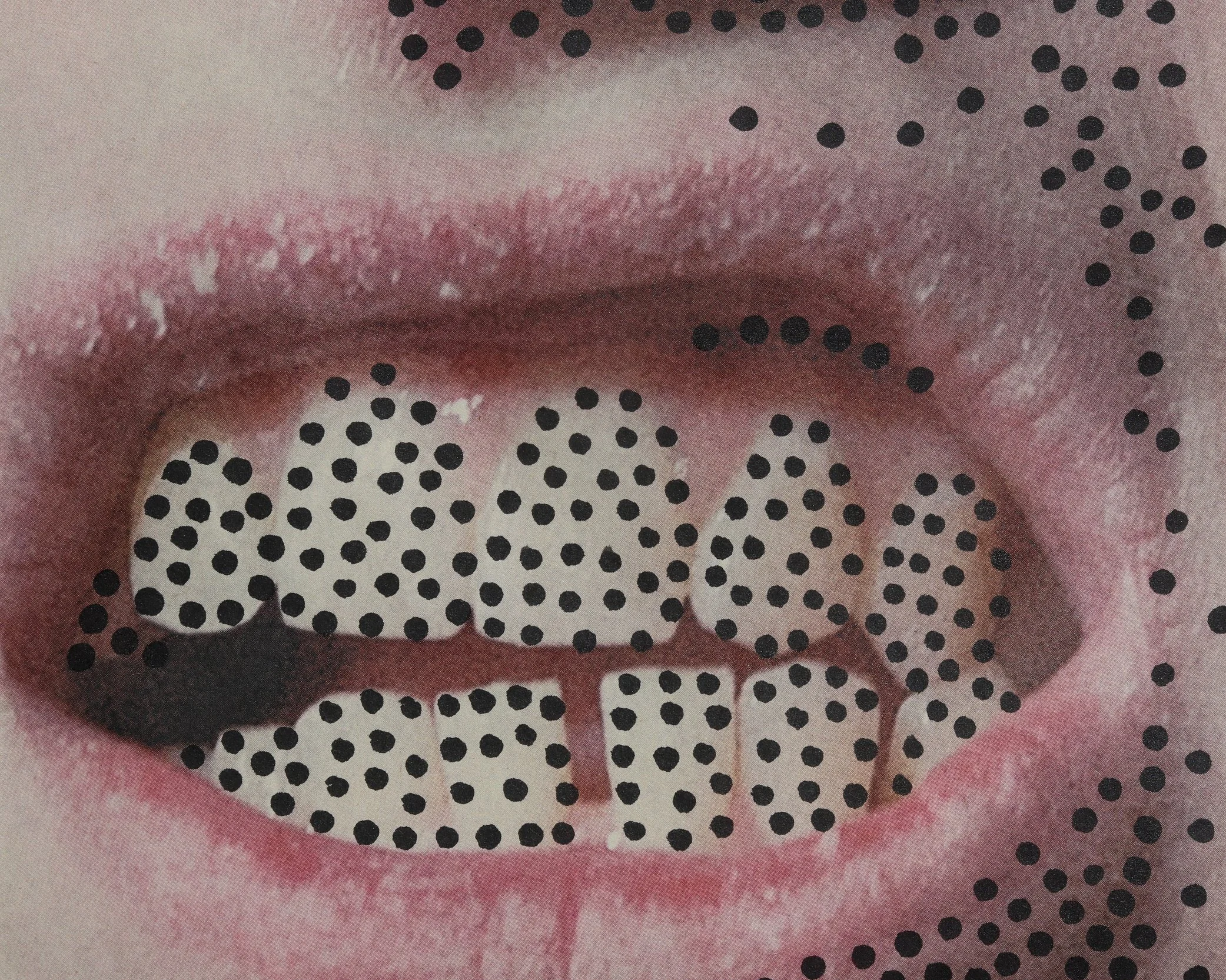 Close-up of a person's lips with black dotted sticker pattern on face.