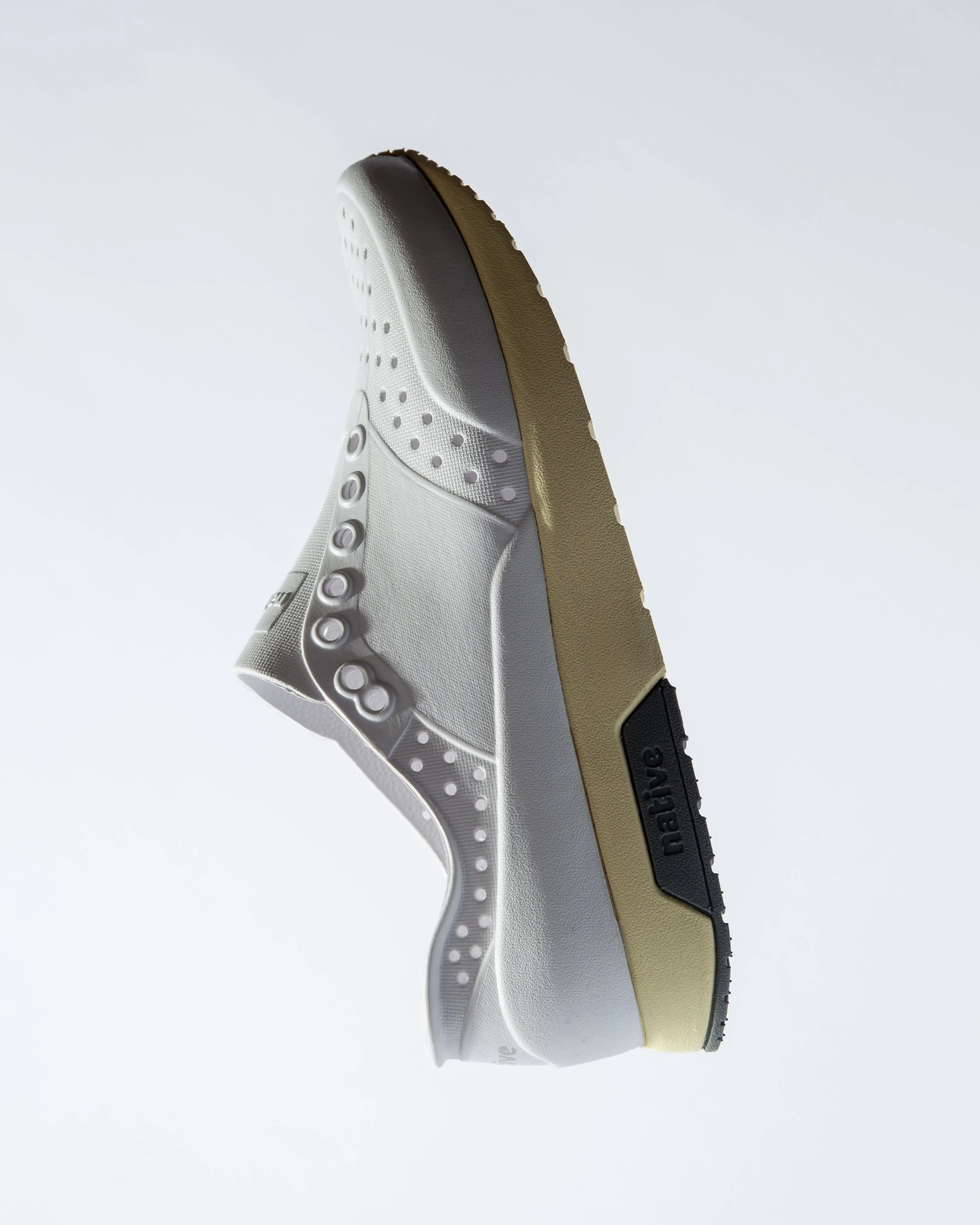 Close-up image of a Nike sneaker showcasing the sole from a side angle against a plain background.