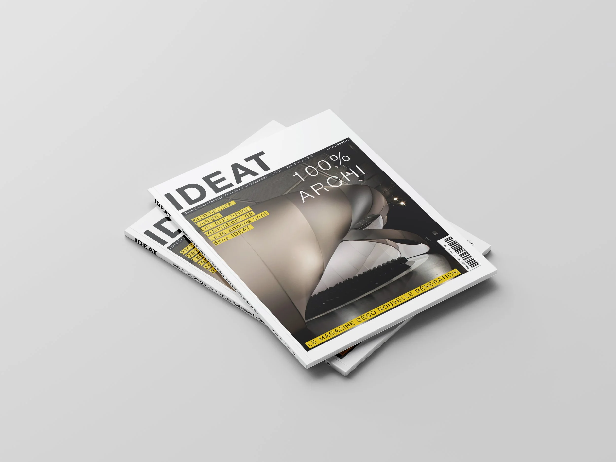 A stack of magazines with a white cover and black text, focused on modern architecture, with an image of a contemporary interior and yellow-highlighted text.