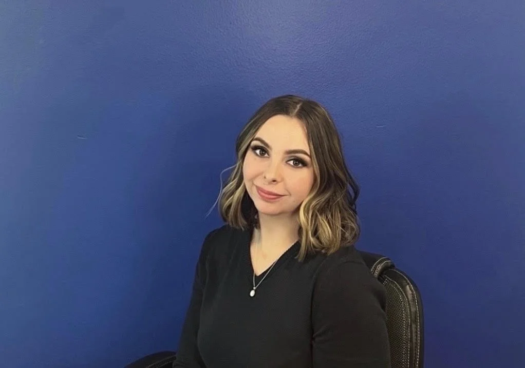 A young woman with shoulder-length wavy hair, A therapist who is ready to talk to you