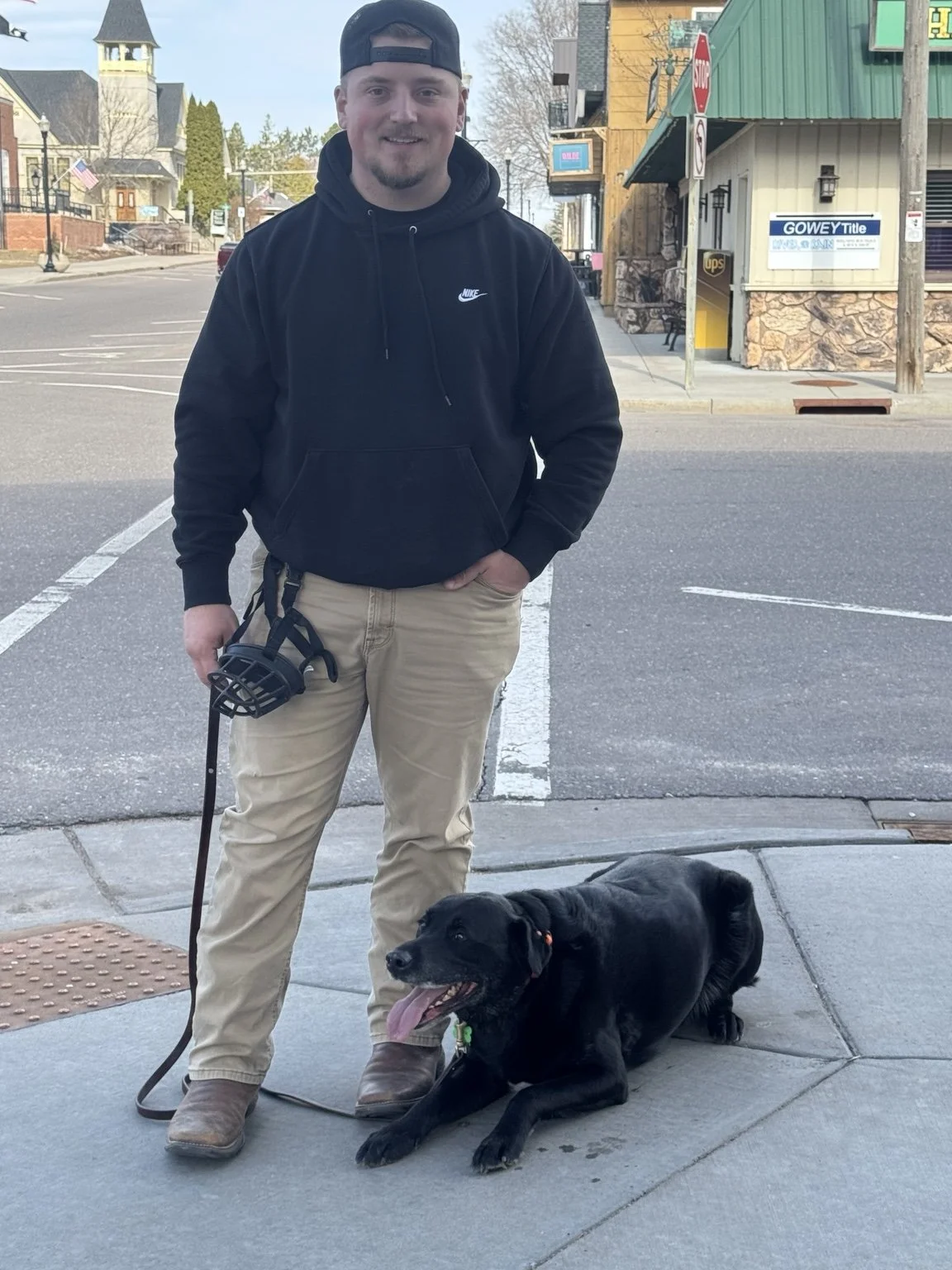 Dalton McCarthy, Training Director at Northwoods K9 Club, with a dog.