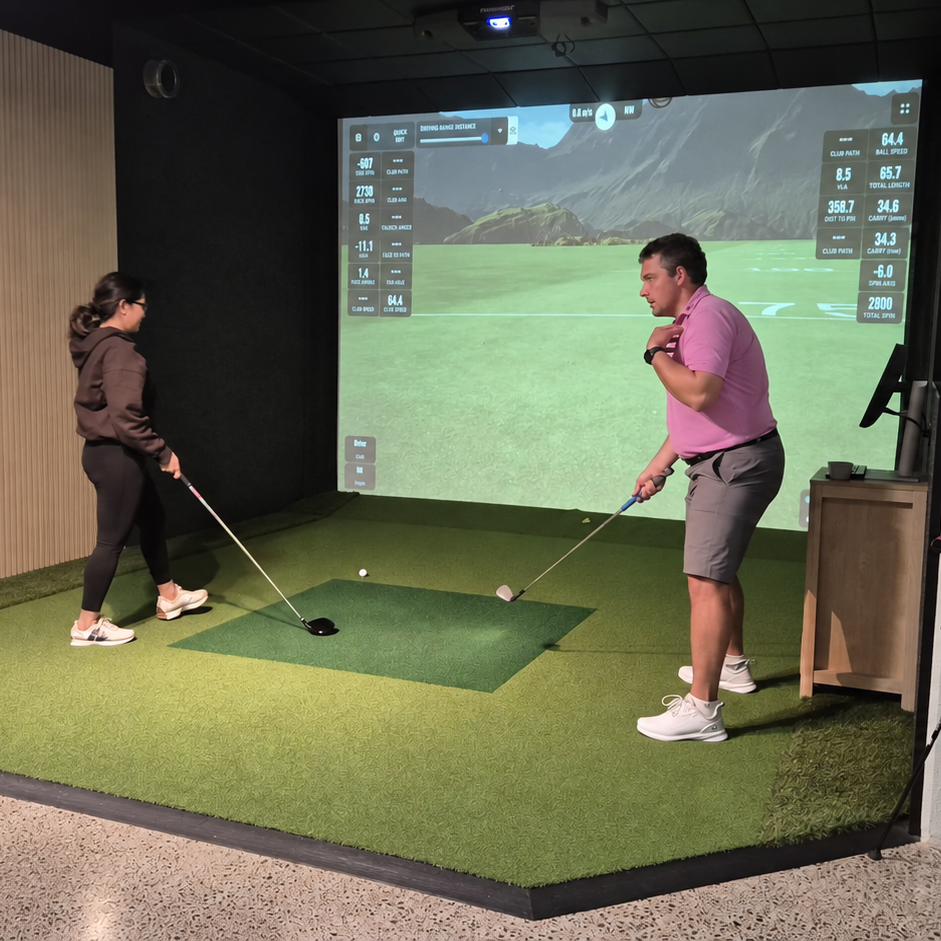 PGA Professional coach coaching beginner golfer in group lesson