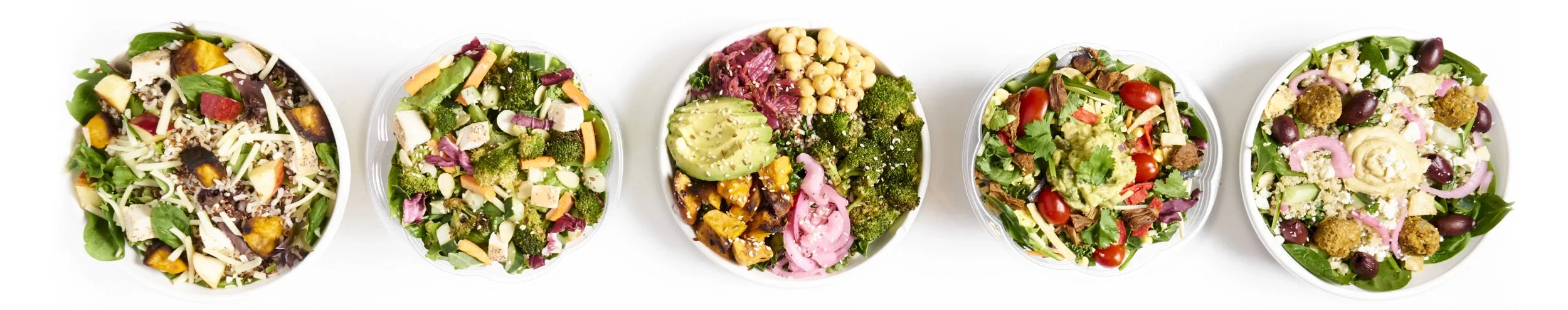 Six beautifully arranged salad plates, highlighting Verde's commitment to fresh, wholesome ingredients on their menu.