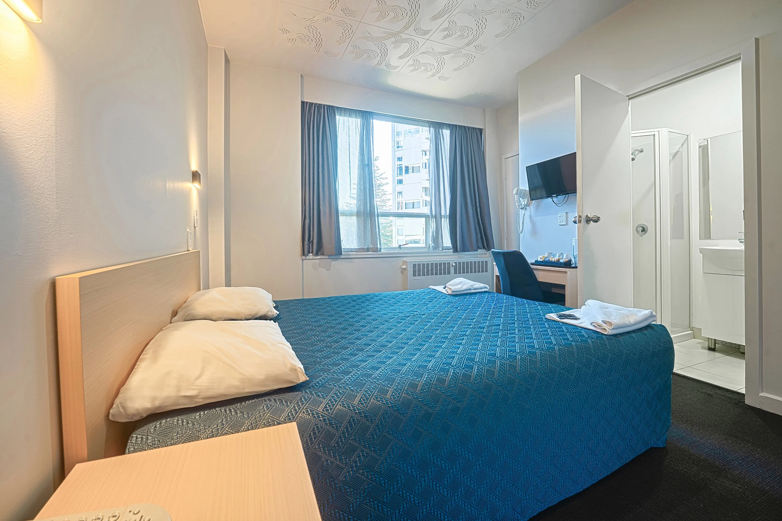 Ensuite Double Furnished with one queen bed, ensuite, t.v, mini fridge and free tea & coffee