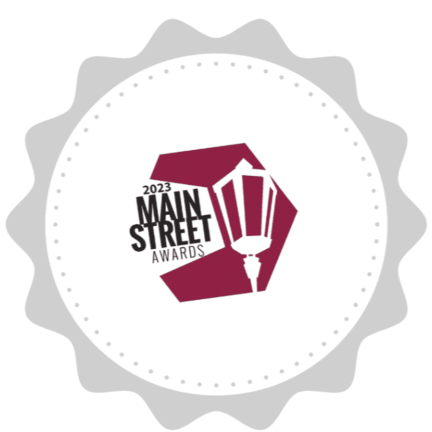 Logo for the 2023 Main Street Awards featuring a street lamp and stylized text.