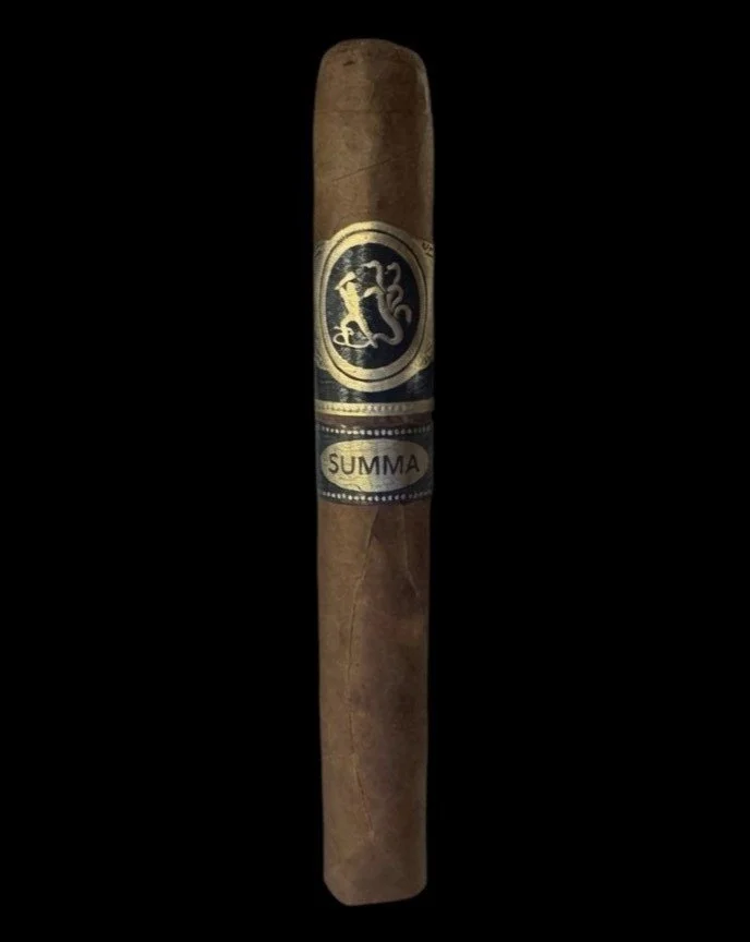 A brown cigar with a black and gold band labeled 'SUMMA' and a lion emblem, set against a black background.