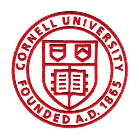 The emblem of Cornell University featuring the university's shield with two shapes and an open book, surrounded by a circular text that reads 'Cornell University' and 'Founded A.D. 1865' in red.