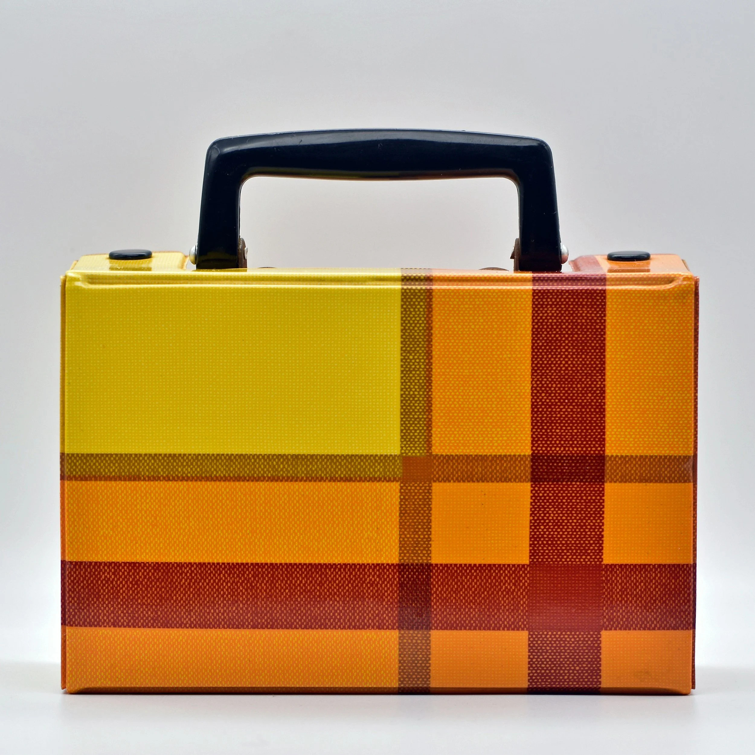 Colorful rectangular box with a black handle on top, featuring a yellow-to-orange gradient with plaid pattern.