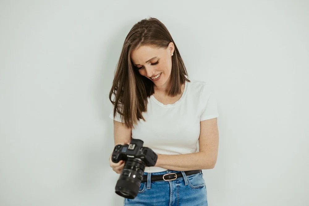 Hannah Cummins, Fraser Valley wedding and family photographer, with her camera