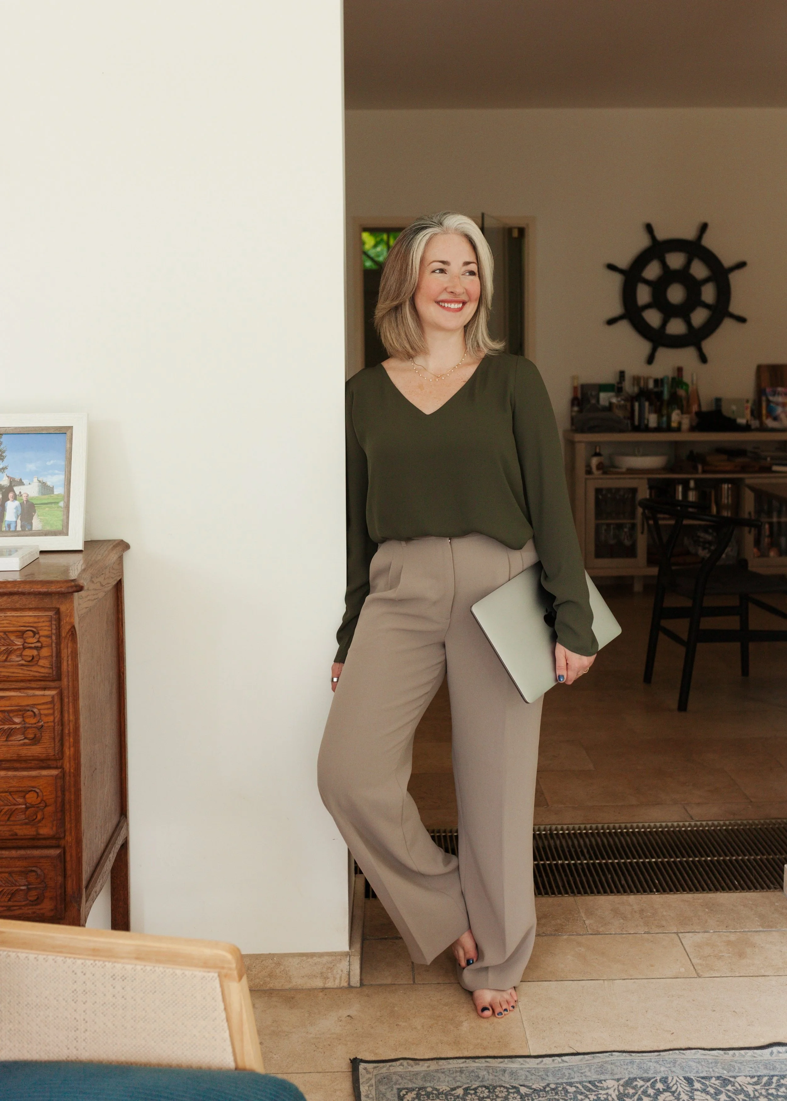 Tara holding a computer