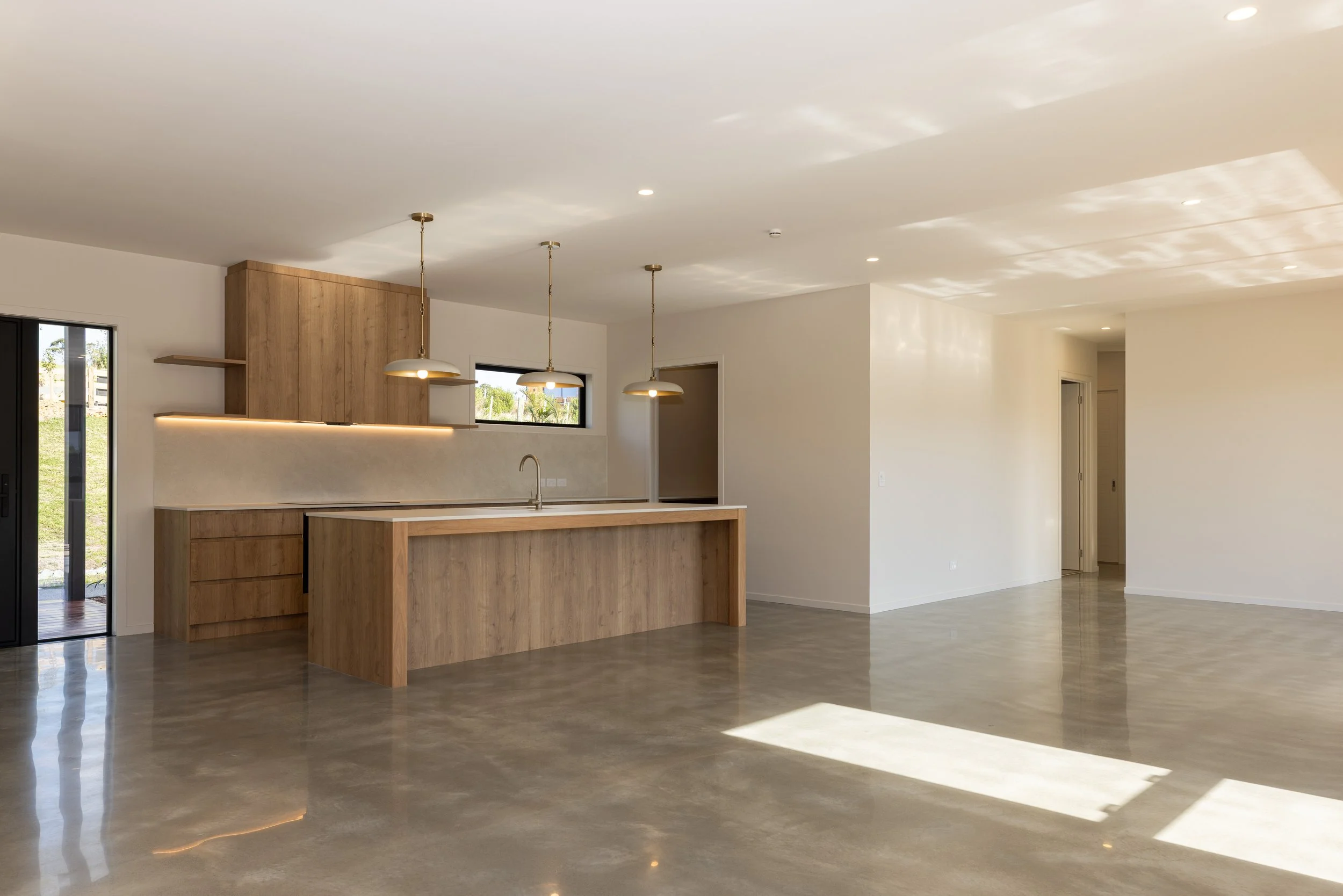 Light-filled living room in completed Benchmark Build home