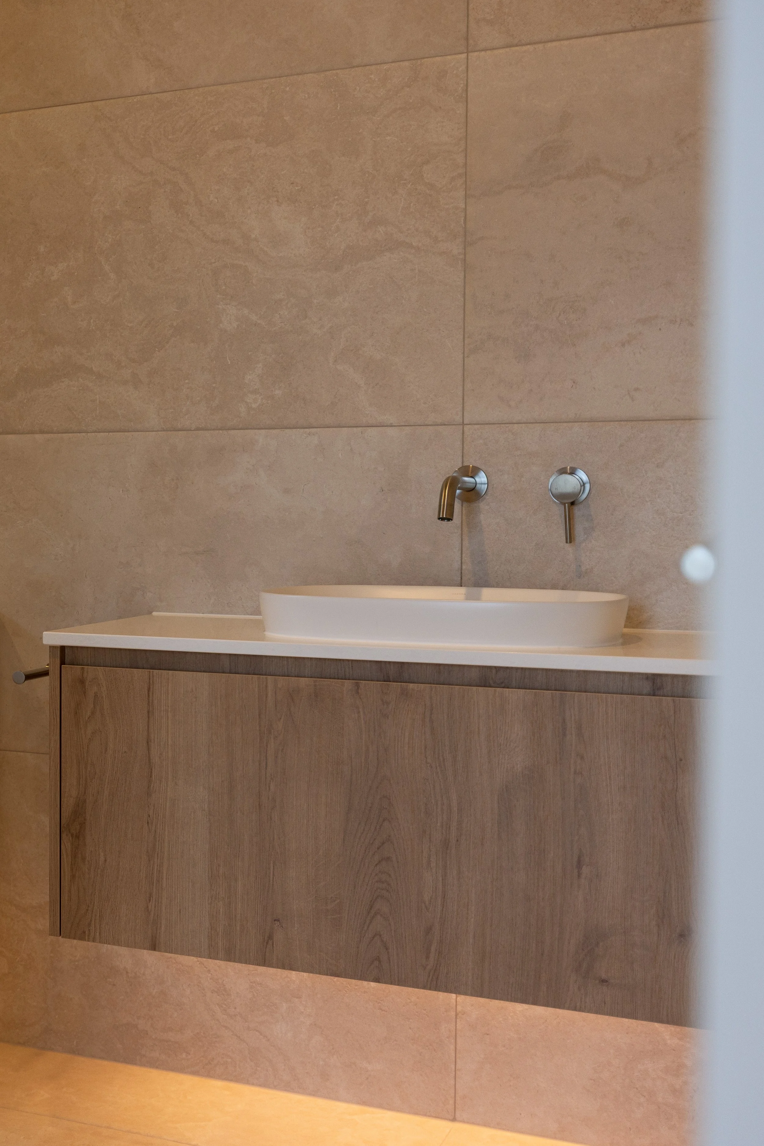 Modern bathroom in completed Benchmark Build home in Mangawhai