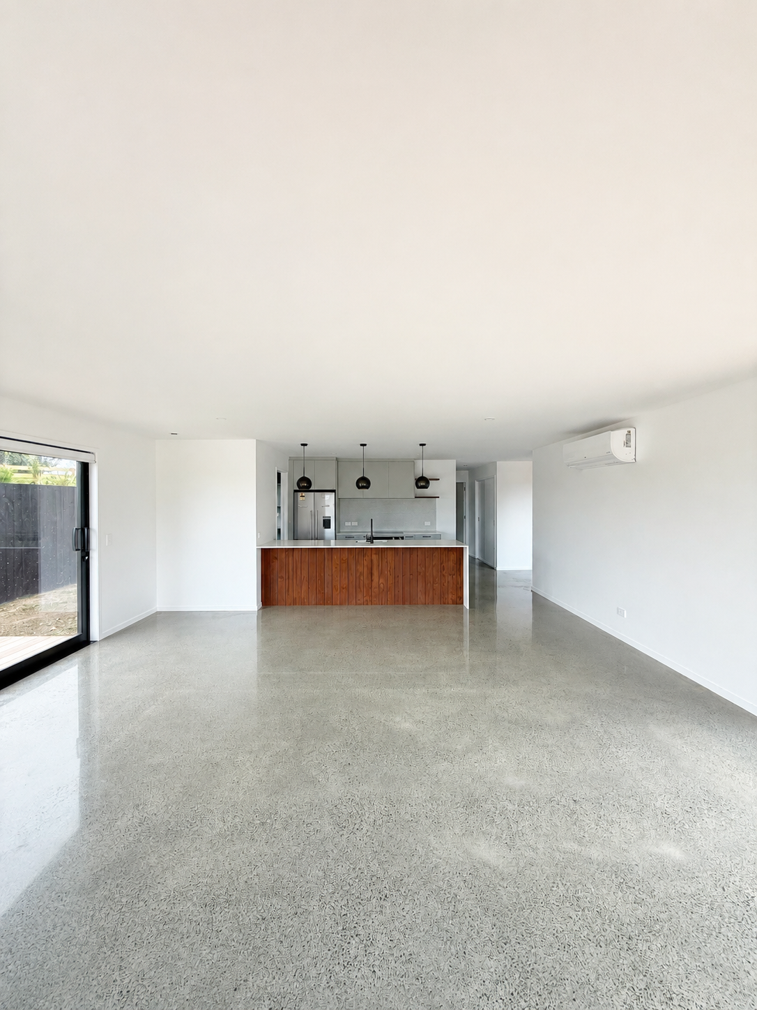 Light-filled living room in completed Benchmark Build home