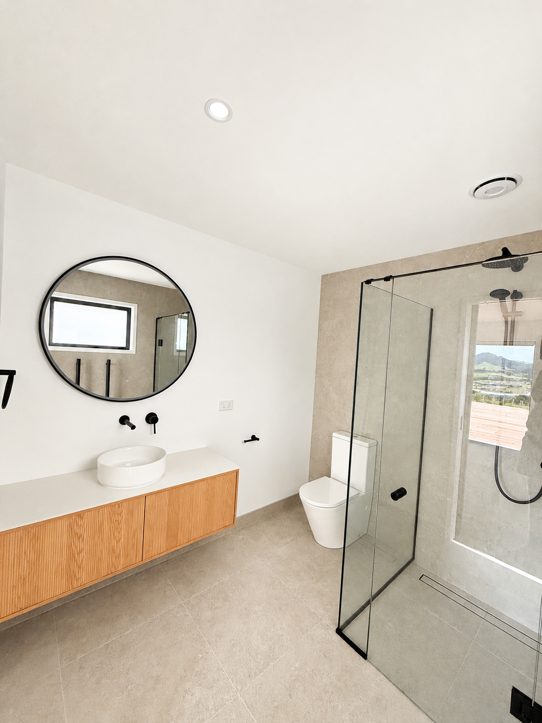 Modern bathroom in completed Benchmark Build home in Mangawhai