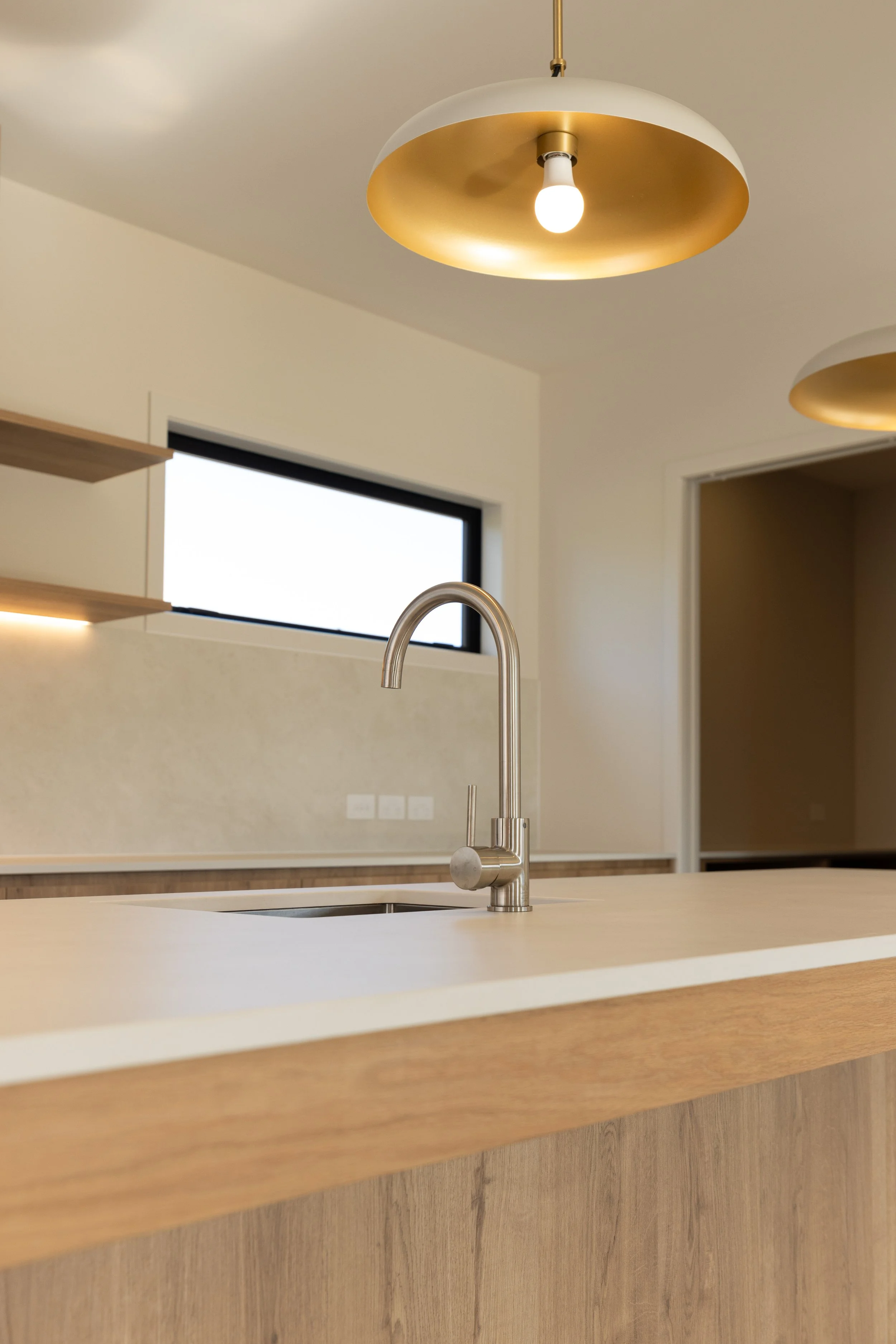 Modern bathroom in completed Benchmark Build home in Mangawhai.