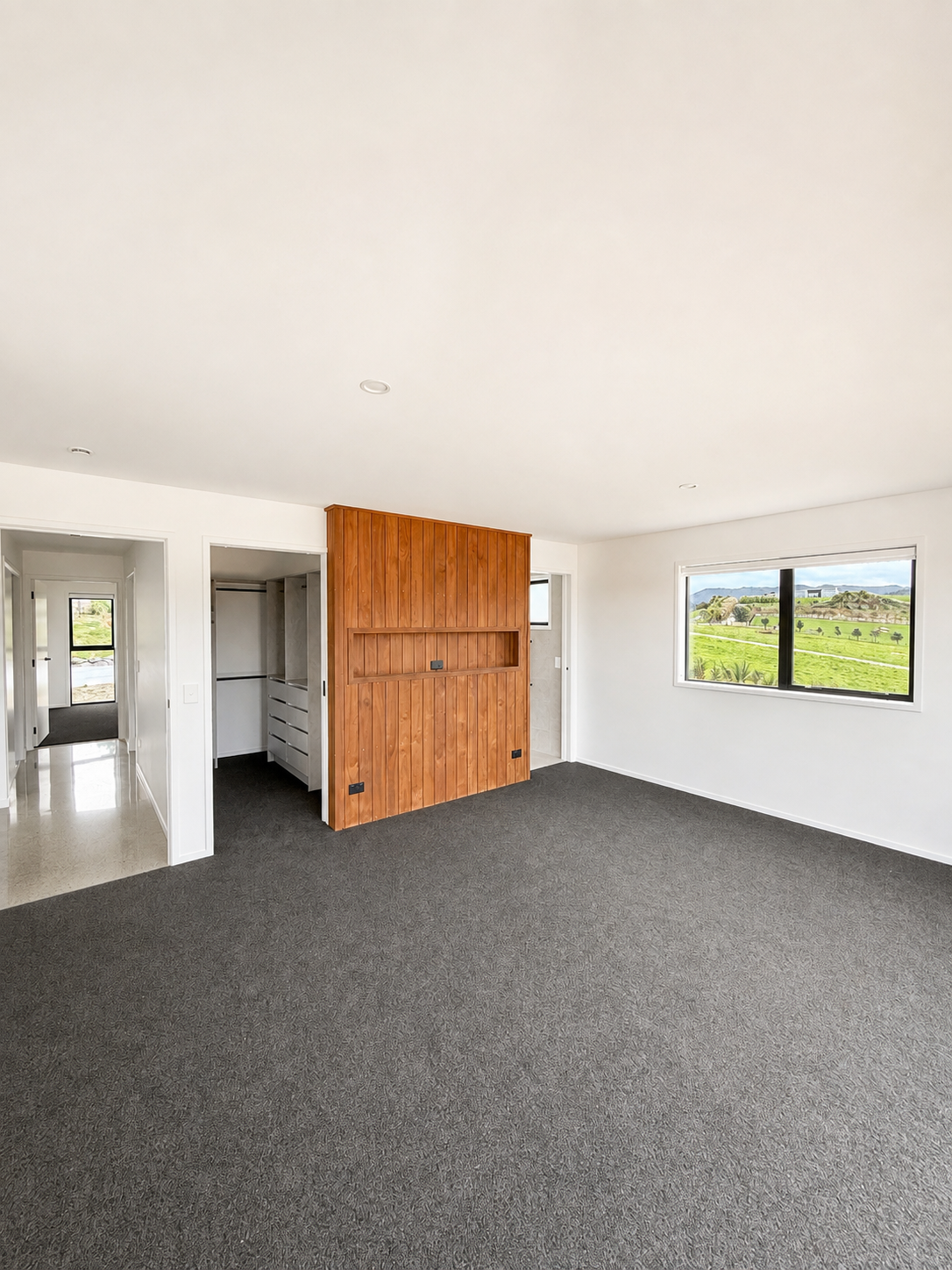 Master bedroom in completed Benchmark Build home in Mangawhai