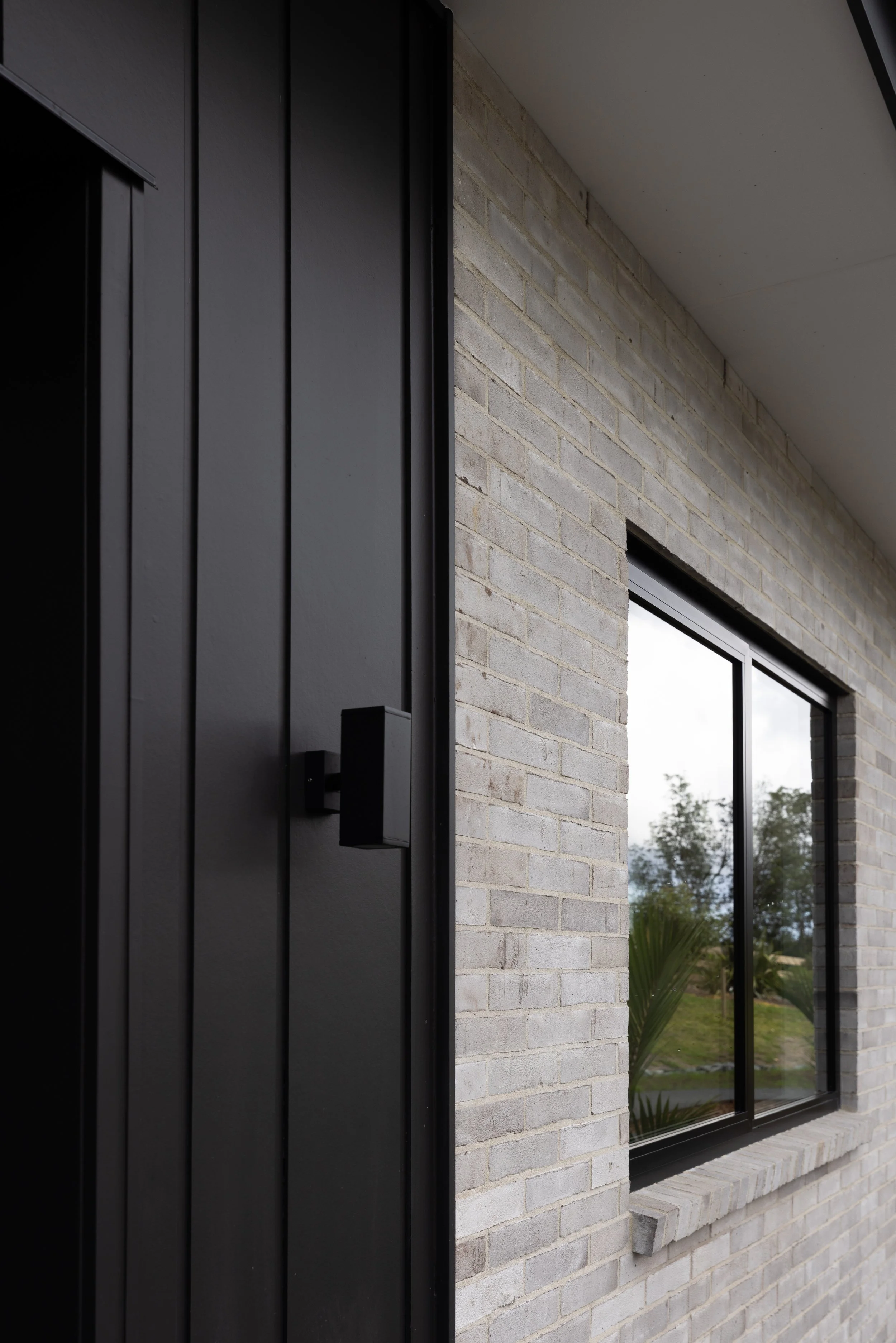 Front exterior of four-bedroom new home built by Benchmark Build in Mangawhai.