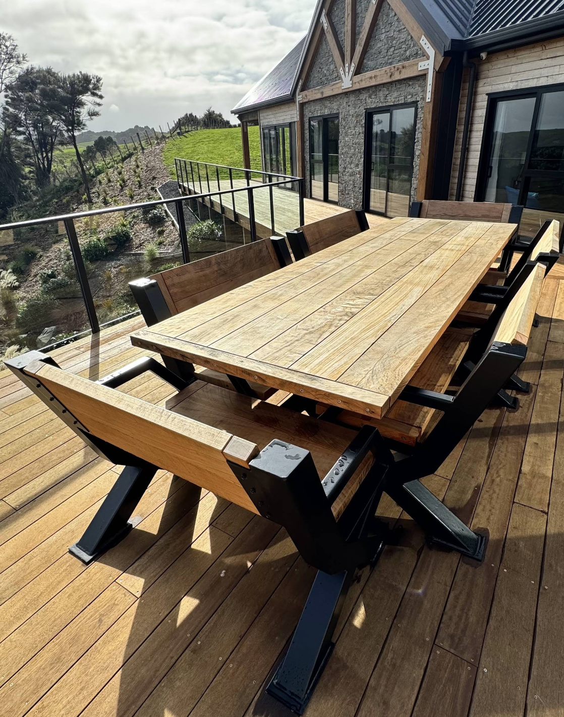 Custom Macrocarpa dining table made by Benchmark Build to suit the customer’s design.