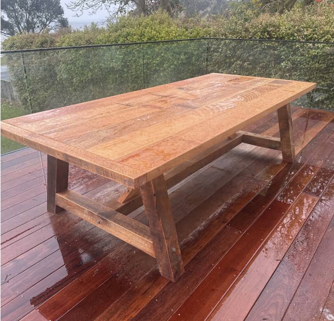 Macrocarpa dining table handcrafted by Benchmark Build in a customer’s home