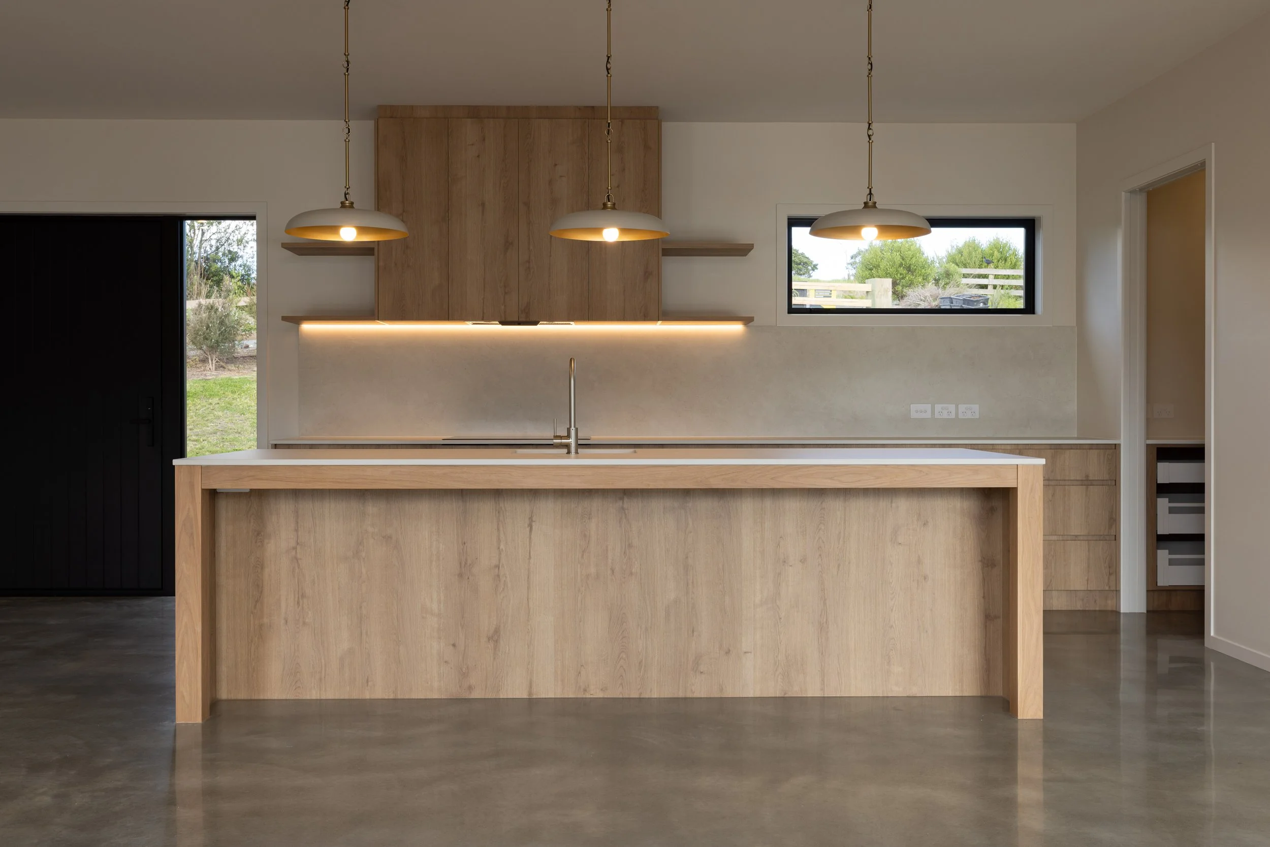 Modern kitchen in completed Benchmark Build home in Mangawhai