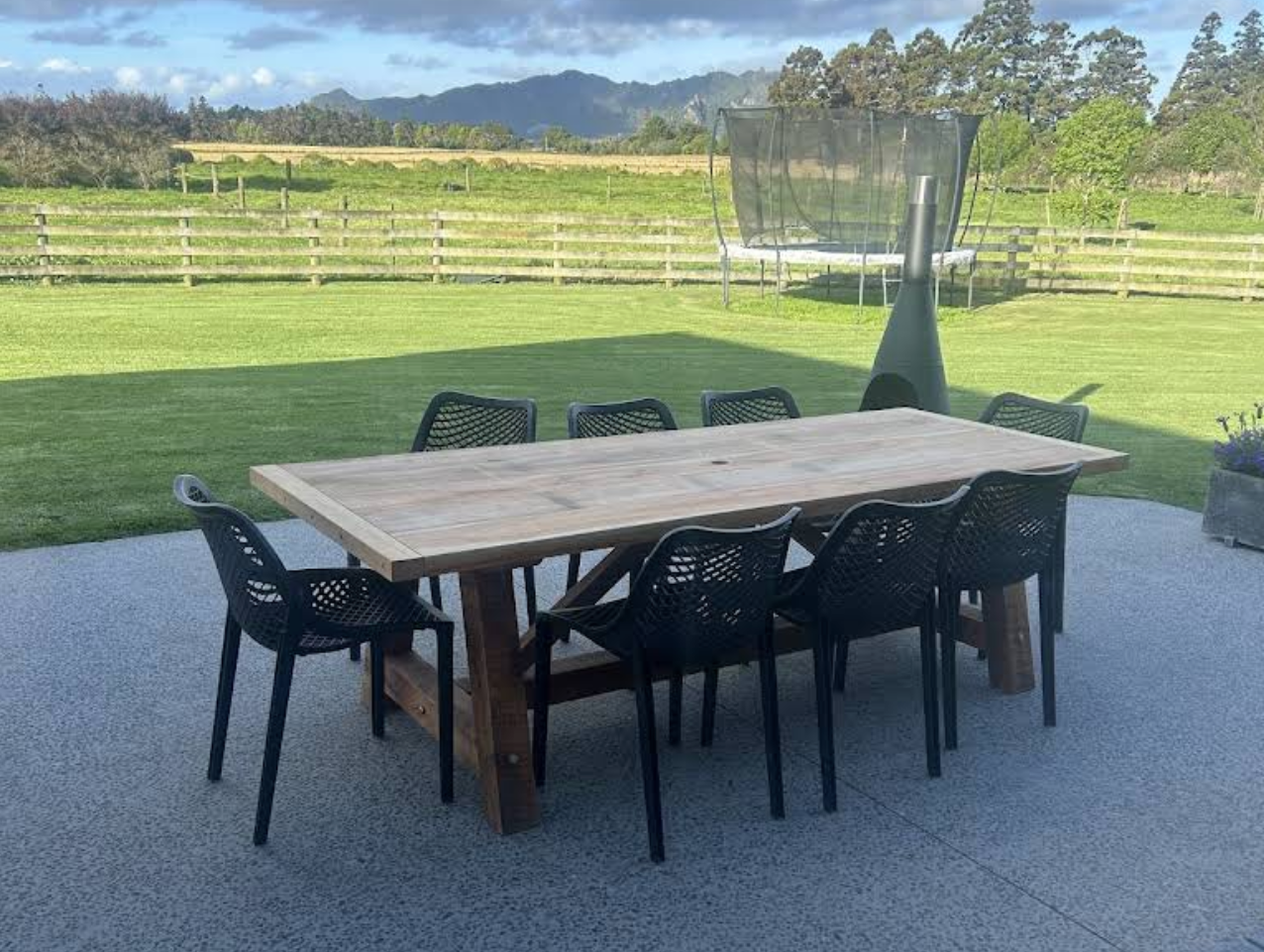 One-of-a-kind Macrocarpa outdoor dining table handcrafted by Benchmark Build.