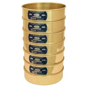 Stack of five gold-colored metal cans with black and blue labels.