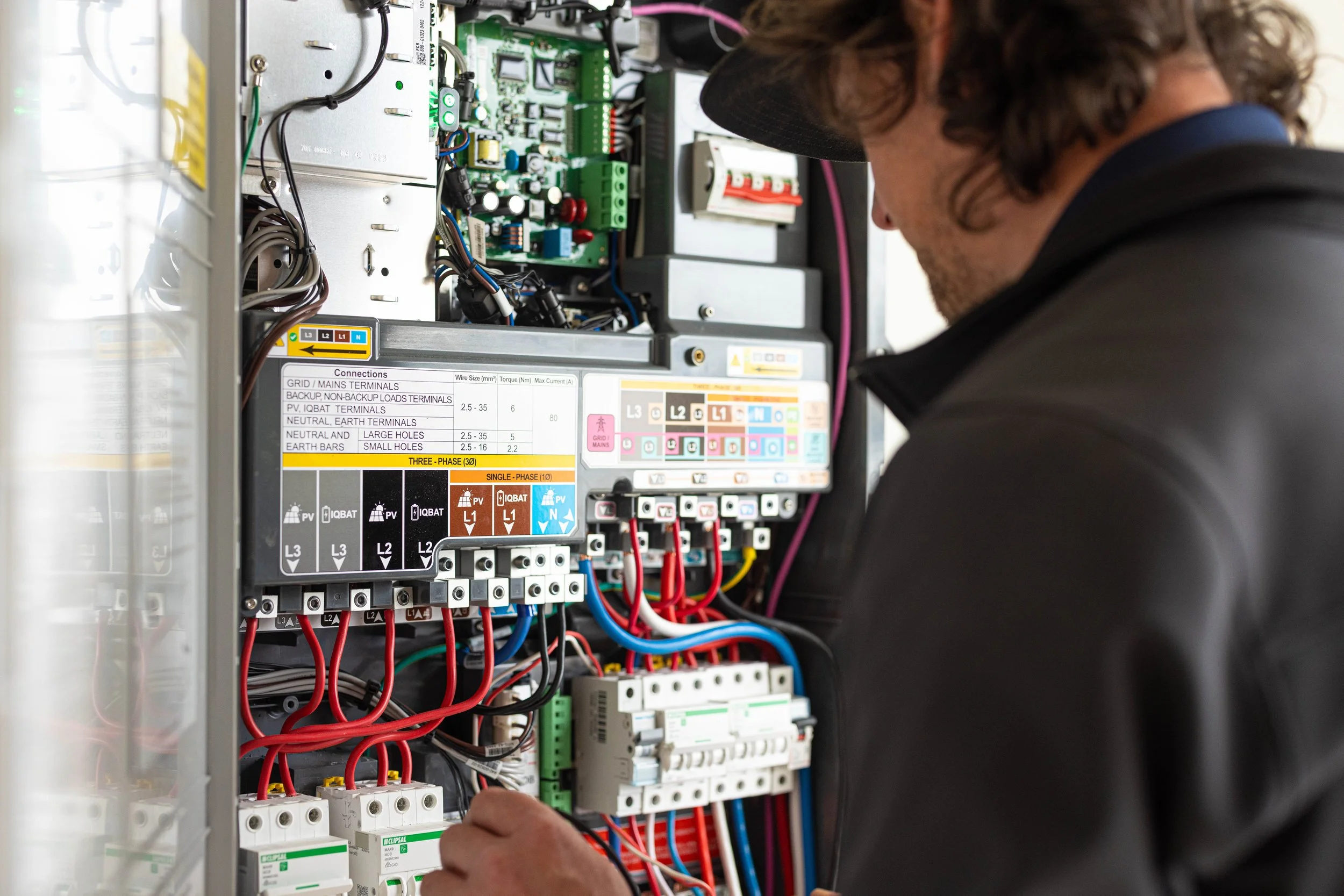 Pete from hunter electrics working on switch board