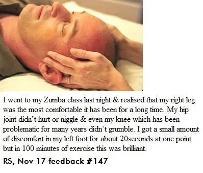 A person receiving a facial massage in a clinical setting.