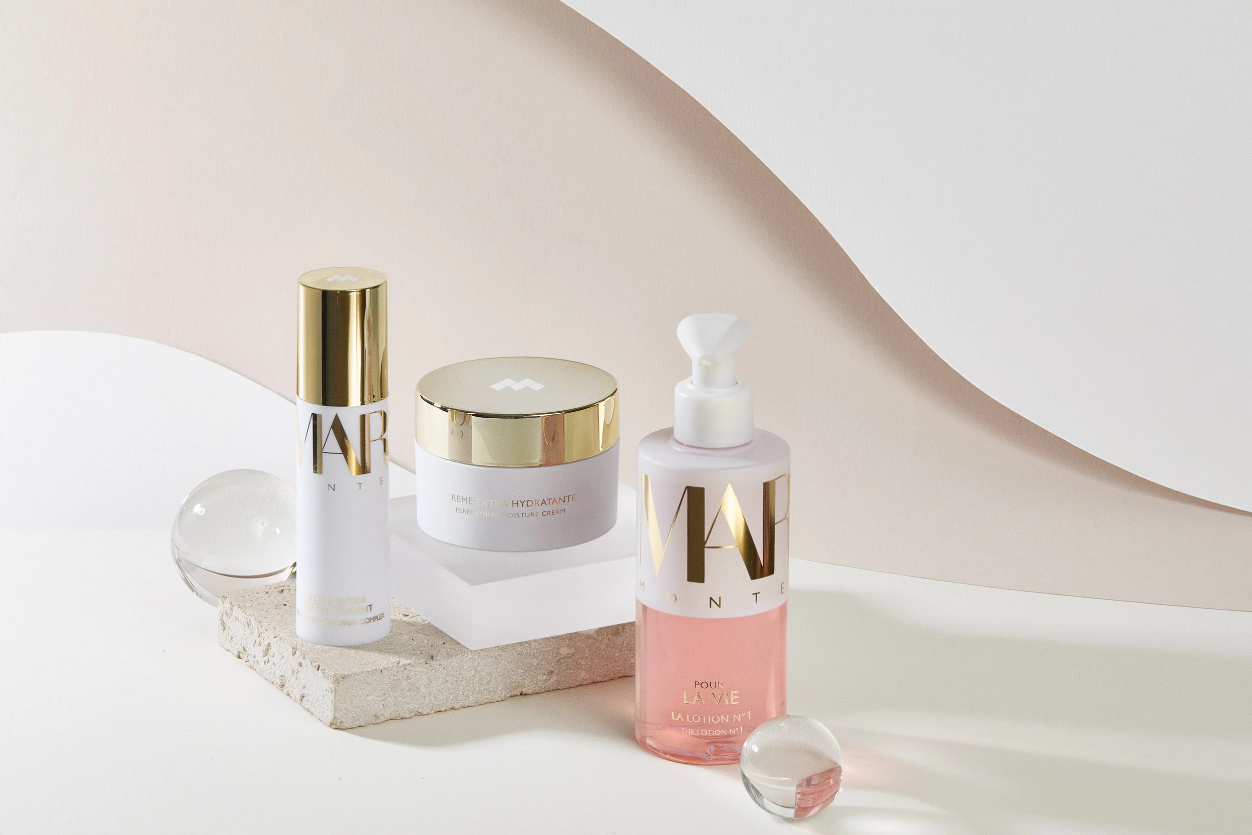 Margy's Monte Carlo Pour La Vie skincare range with white and gold packaging, available at Ponsarin Clinic.
