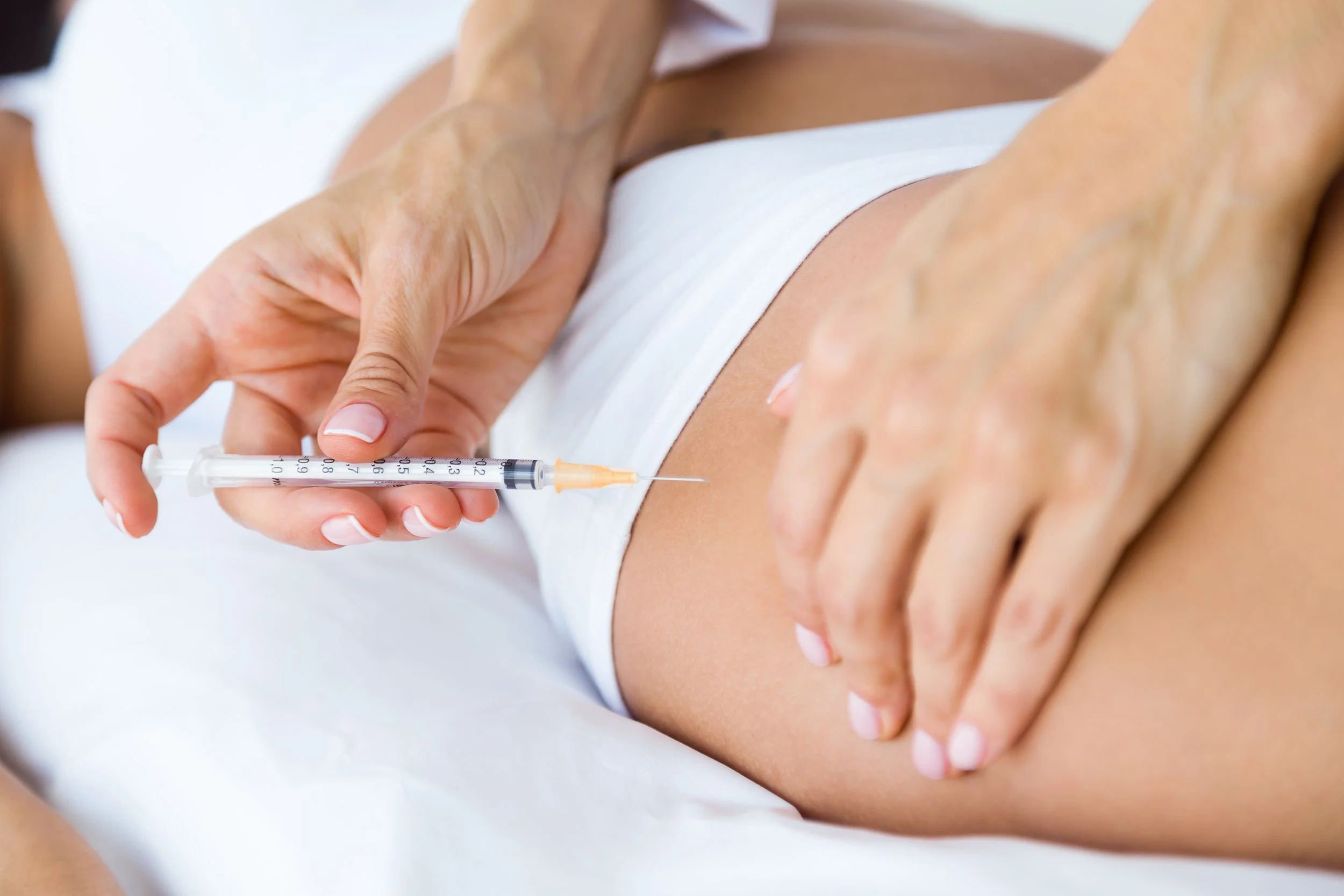 Close-up of a mesotherapy injection being administered to the thigh for targeted body contouring and localized fat treatment.