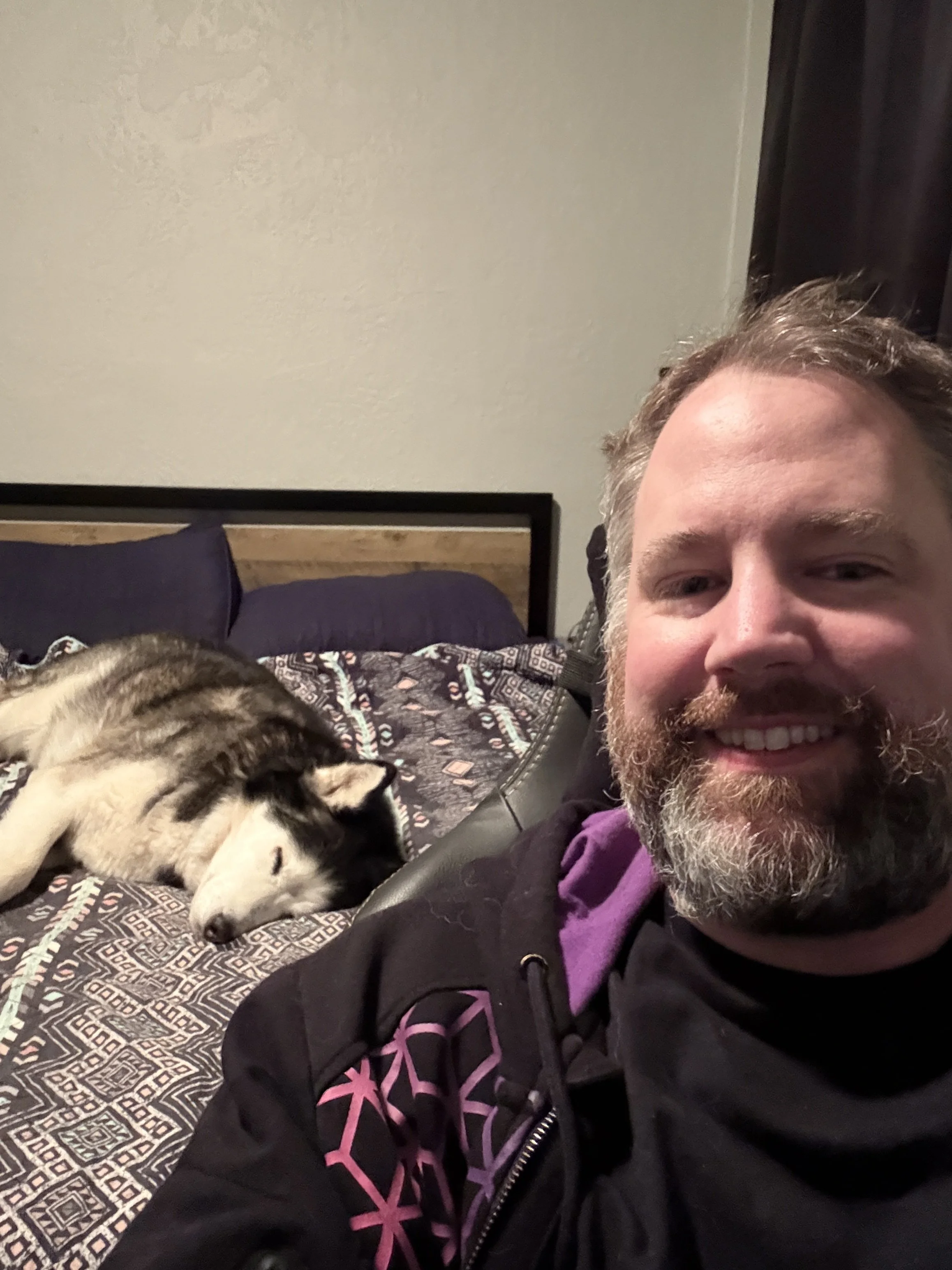 Lounging in my room with Loki enjoying the bed!