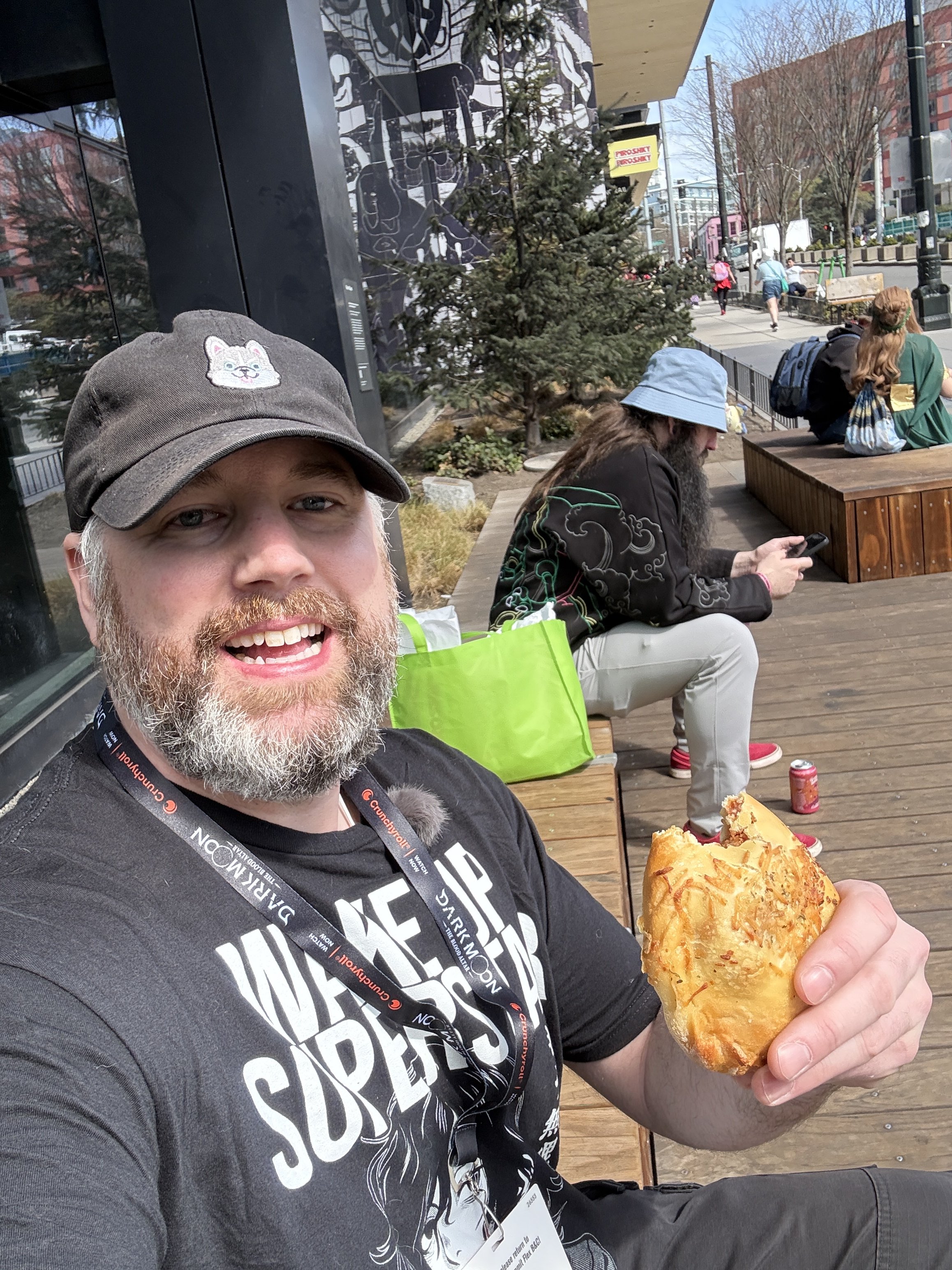 Sakura-con 2026, eating a snack watching the crowds.