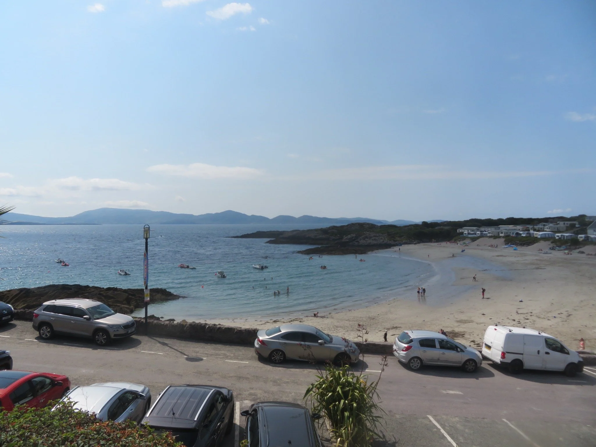Cars parked along the roadside beside Inch Beach on Ireland's Dingle Peninsula