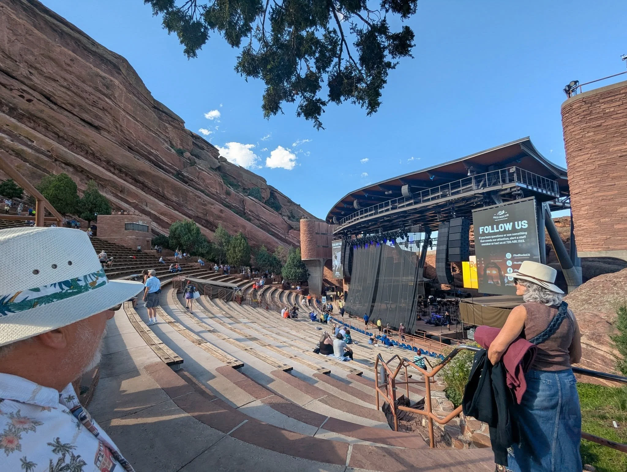 View of Red Rocks Amphitheatre in Morrison, Colorado, with its outdoor concert stage, steep seating, and surrounding red sandstone formations before a Beach Boys concert in August 2025.