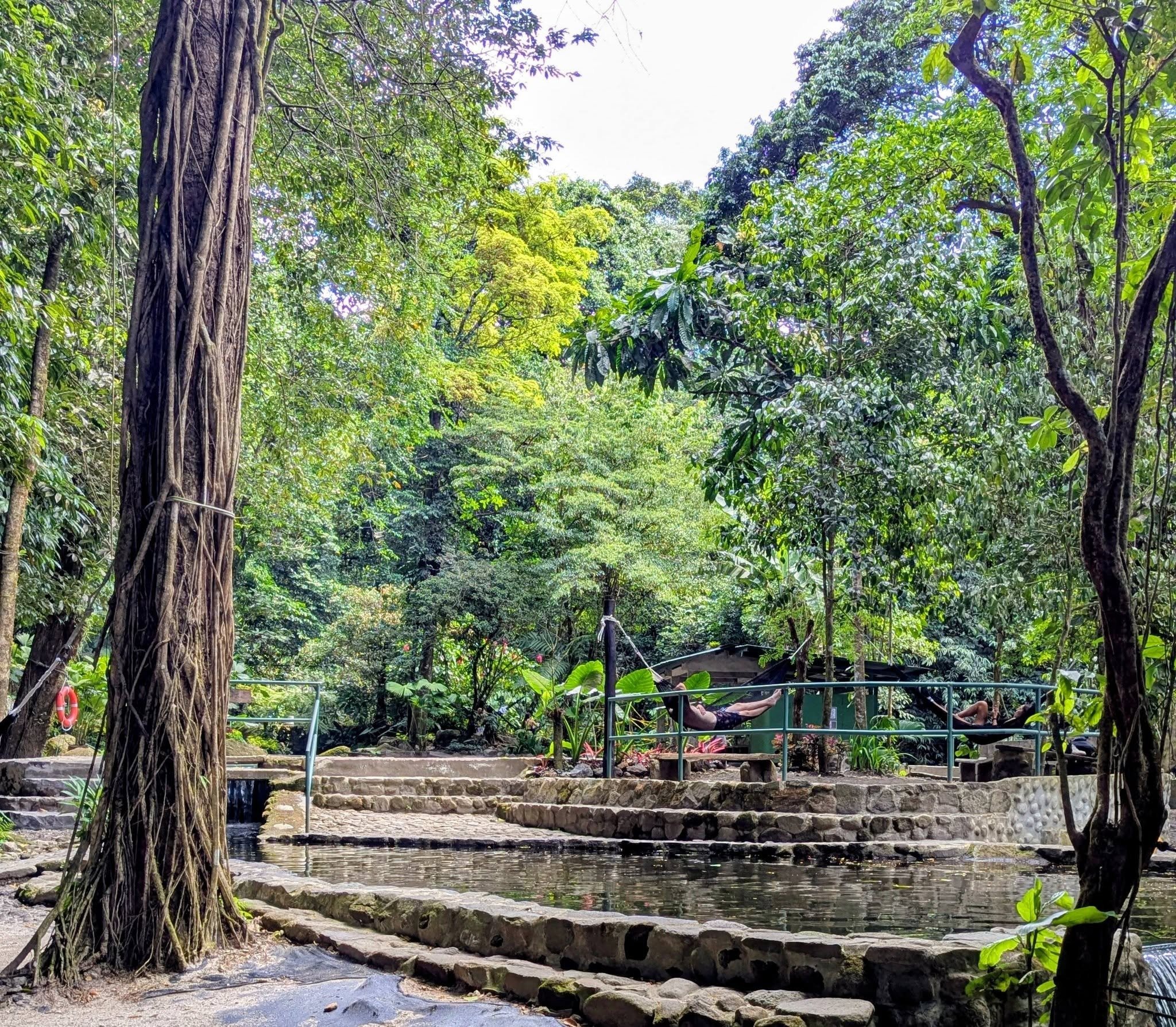 Rustic thermal pools surrounded by tropical forest at Piscinas Termales El Valle de Antón in Panama.