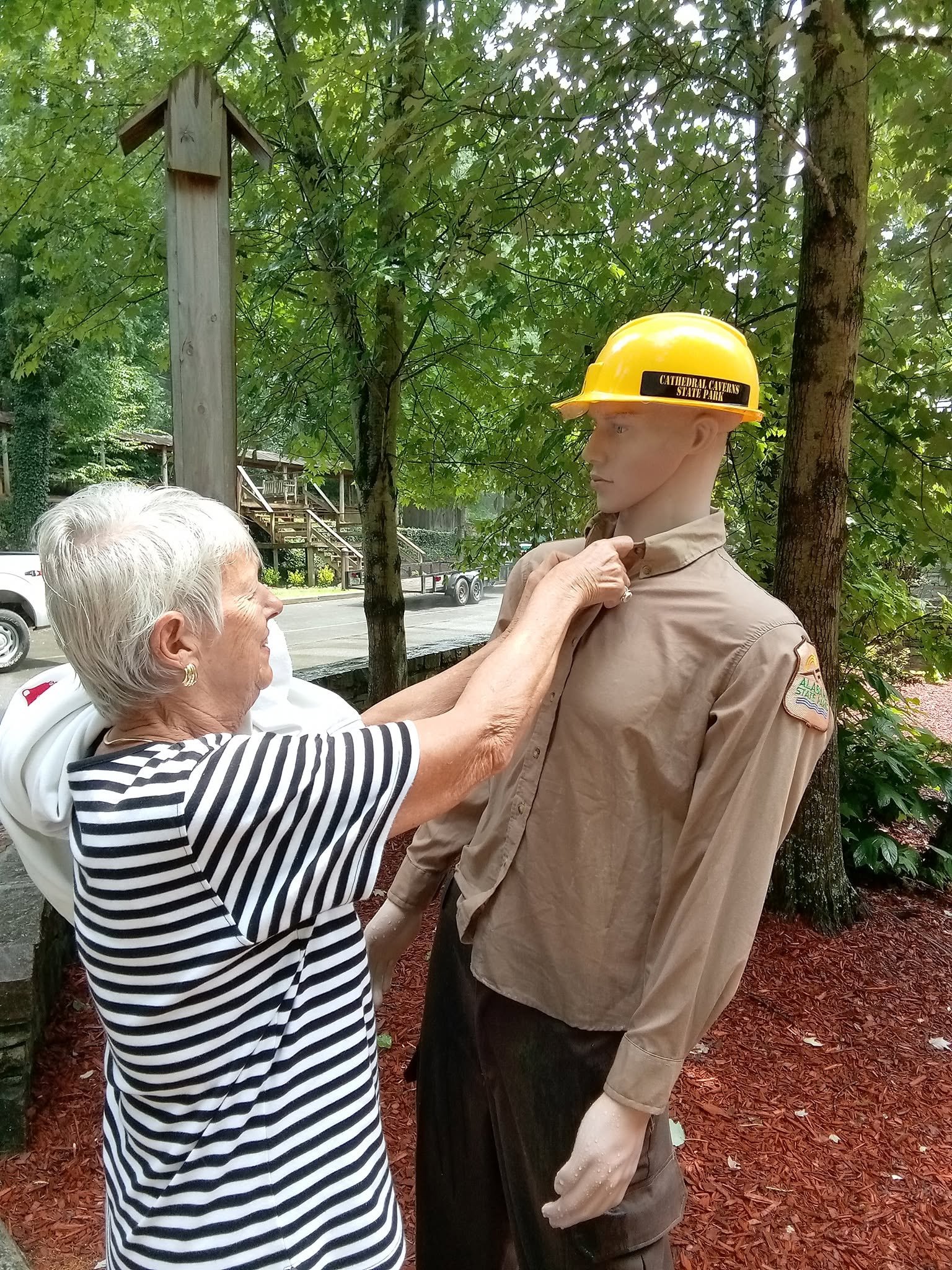 Sue adjusts the collar on a worker mannequin during a family day trip to Lynchburg, Tennessee.