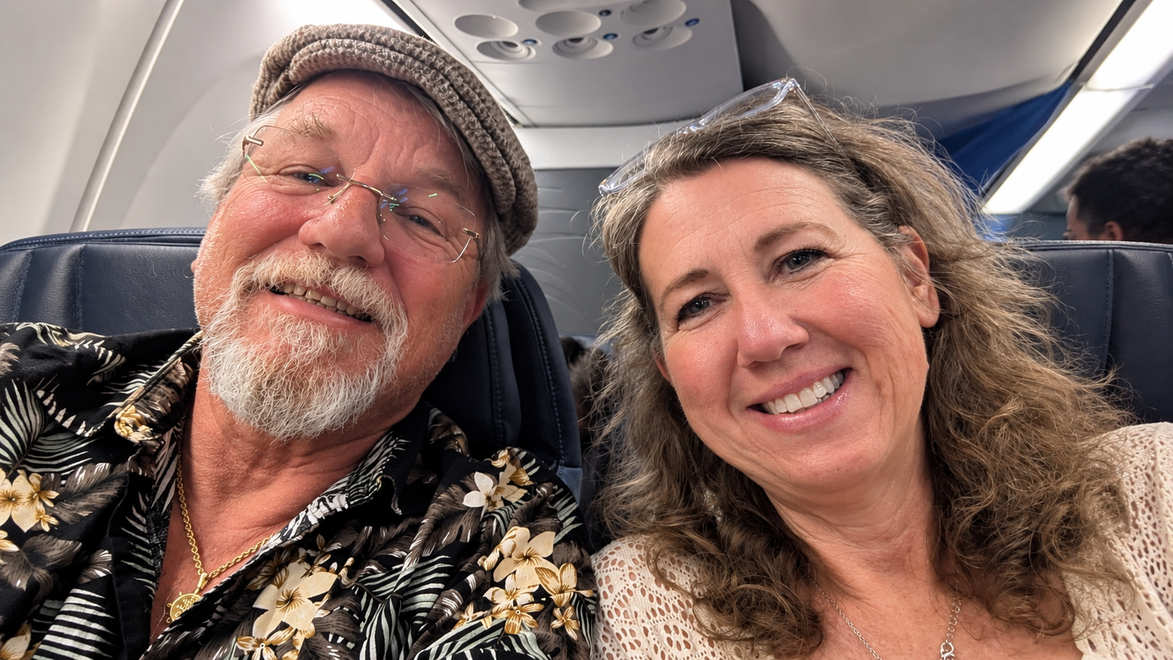 Couple seated together aboard a Copa Airlines flight from Orlando to Panama City.