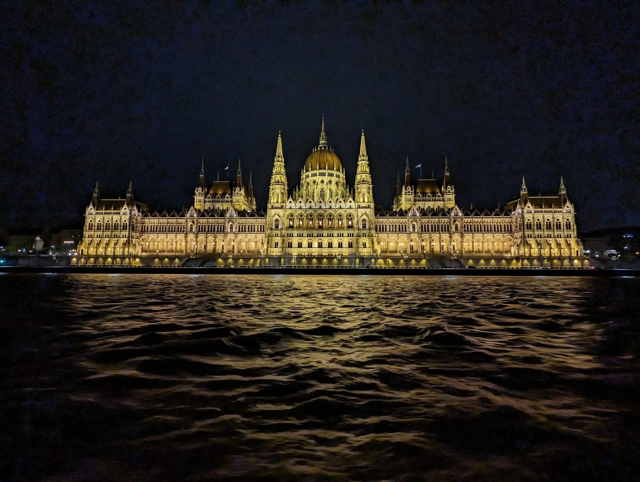 Budapest's magnificent Parliament building, illuminated against the night sky.