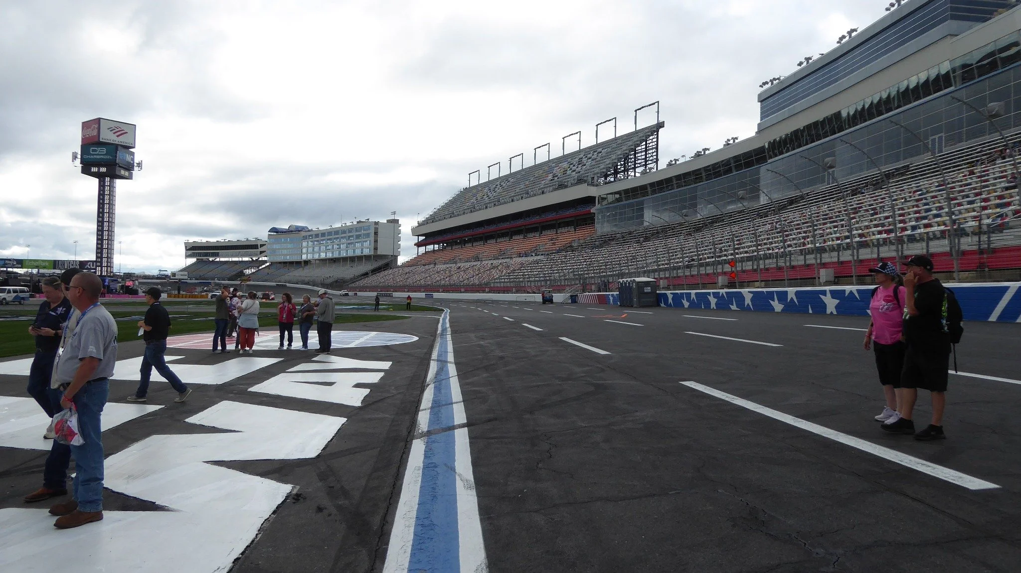 Looking up at Charlotte Motor Speedway grandstands from the racing surface.