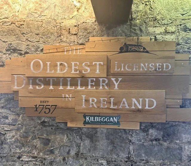 Sign at Kilbeggan Distillery noting its founding in 1757 and its history as a licensed Irish whiskey distillery.