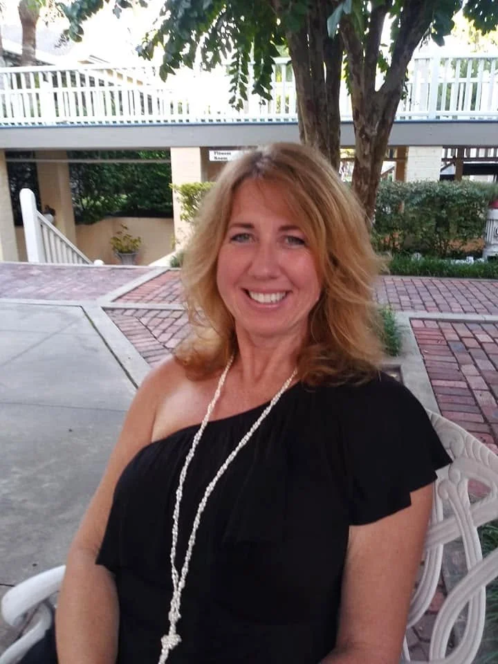 Gina relaxing in the courtyard of the historic Jekyll Island Club Resort during an anniversary weekend.