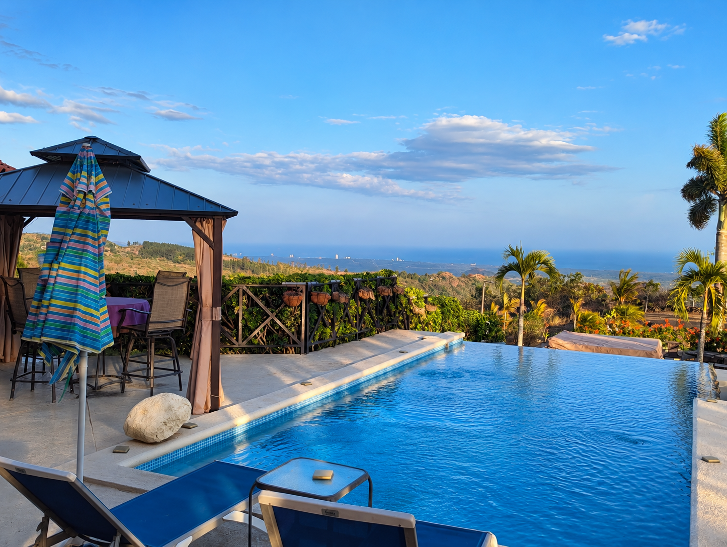 Infinity pool and outdoor seating at Hawk’s Nest in La Laguna, Panama, overlooking the mountains toward the Pacific coast.