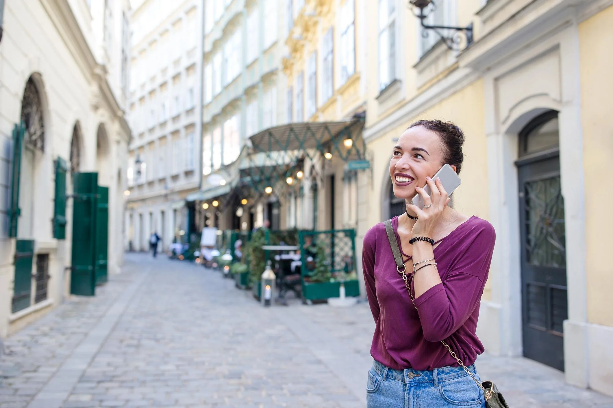 Woman using a mobile phone while traveling in Italy