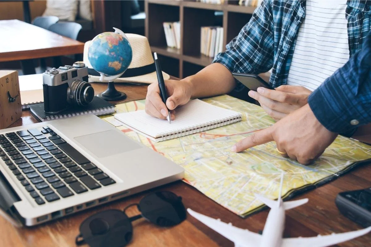 Couple planning a trip together using a globe