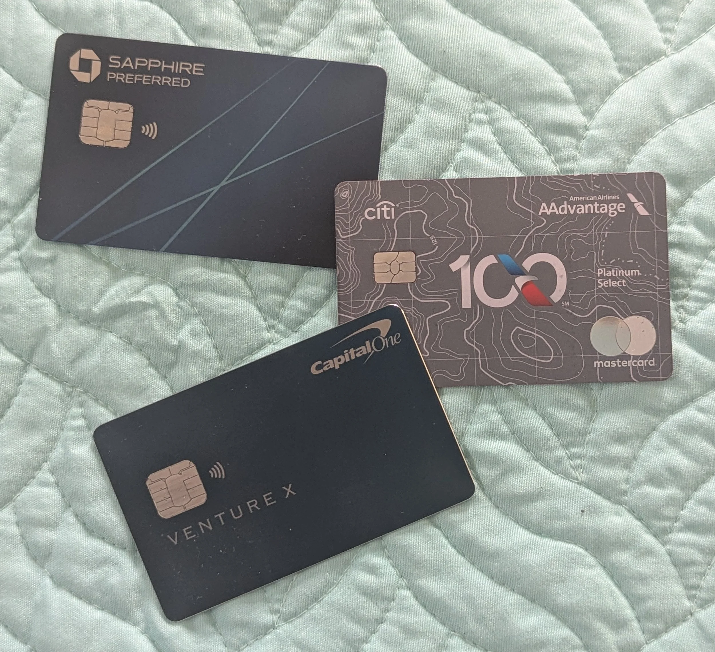 Capital One Venture X, Chase Sapphire Preferred, and Citi AAdvantage credit cards compared for travel rewards.