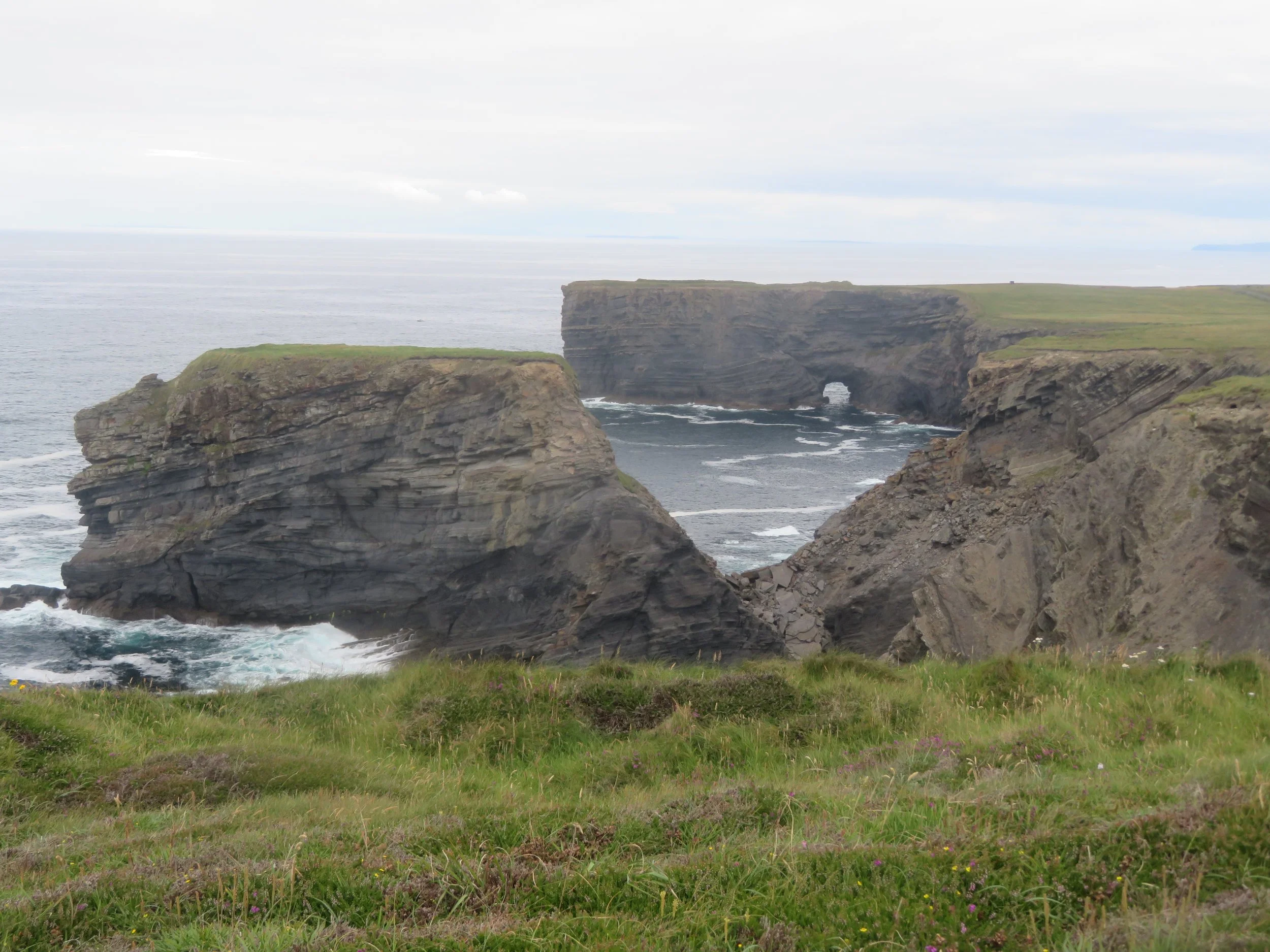 Rugged Atlantic coastline and sea cliffs along the Kilkee Cliffs in County Clare, Ireland
