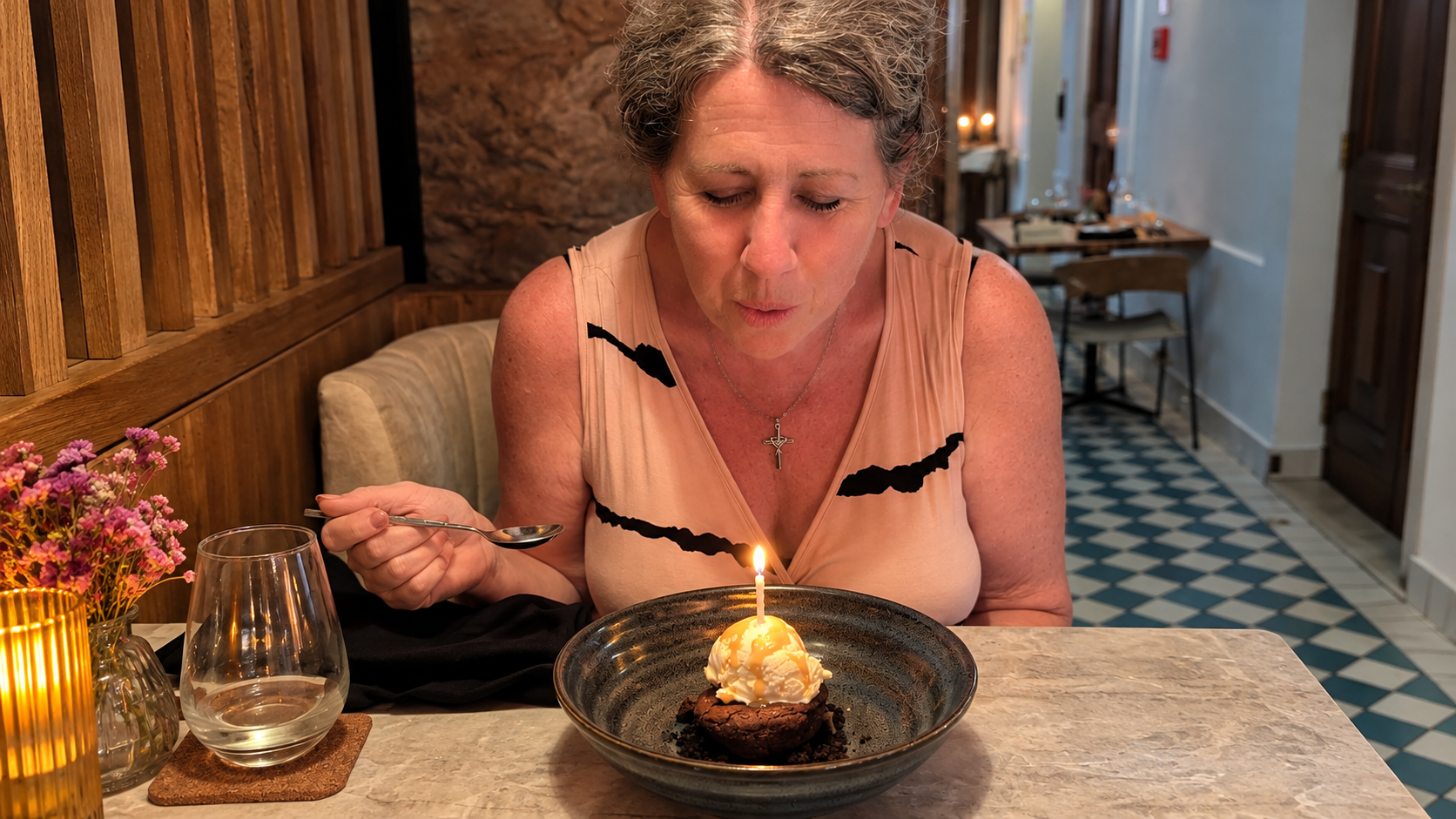 Gina blowing out the candle on her birthday dessert at Kaandela in Panama City, Panama.