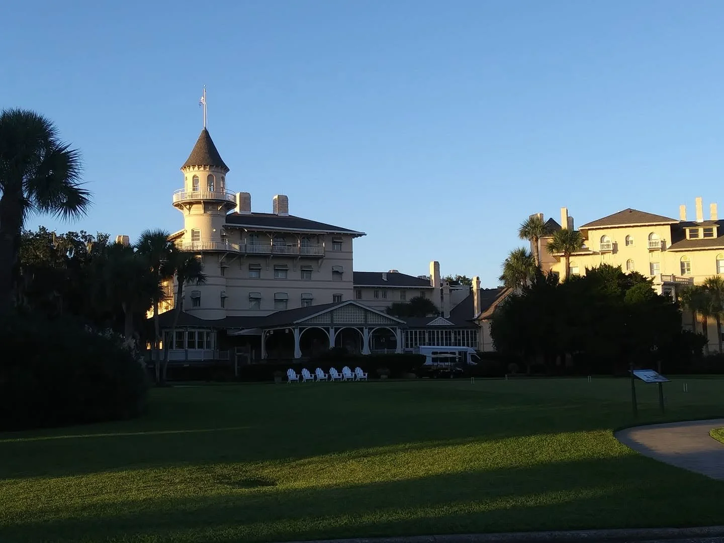 Historic Jekyll Island Club Resort in Georgia, featuring its distinctive architecture, tower, and landscaped grounds.