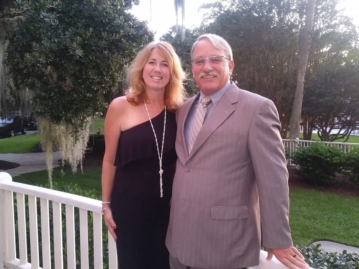 Couple dressed for an anniversary dinner at the historic Jekyll Island Club Resort in Georgia.